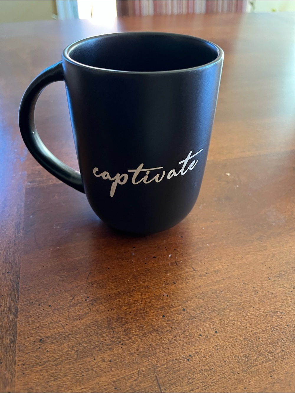 Nicole Miller Black Ceramic Mug with White Script "captivate"
